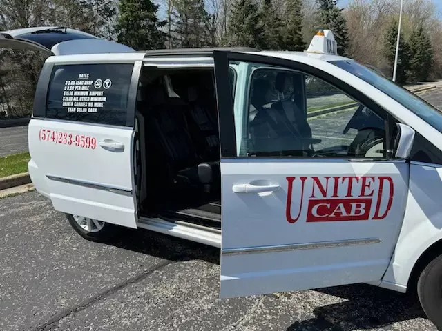 United Cab taxi van in South Bend with the 574-233-9599 phone number on the door