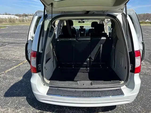 Luggage space in a United Cab shuttle van, rear doors open